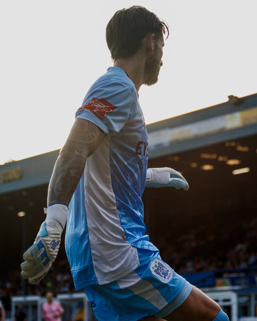 Goalkeeper wearing Paxsport Classic Aqua gloves on the pitch
